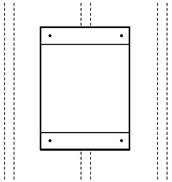 Medicine cabinet against wall with drill holes in all four corners